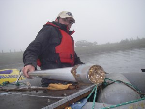 Nick recovers a sediment core for his PhD project.