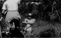 The author pulling a canoe through the marsh at Zancudococha in 1988. Photo: Miriam Steinitz-Kannan.